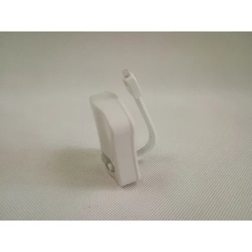 White battery-operated LED toilet bowl light. Product sold online, in particular via www.cool-mania.eu.