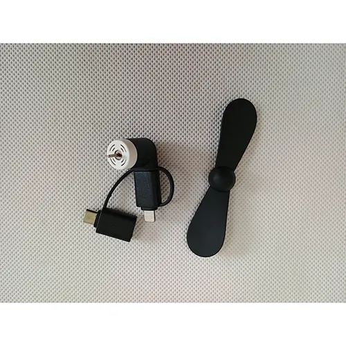 Small USB fan of black colour with two types of connectors included. The fan can be attached to a mobile phone. Product sold online, in particular via www.nay.sk.