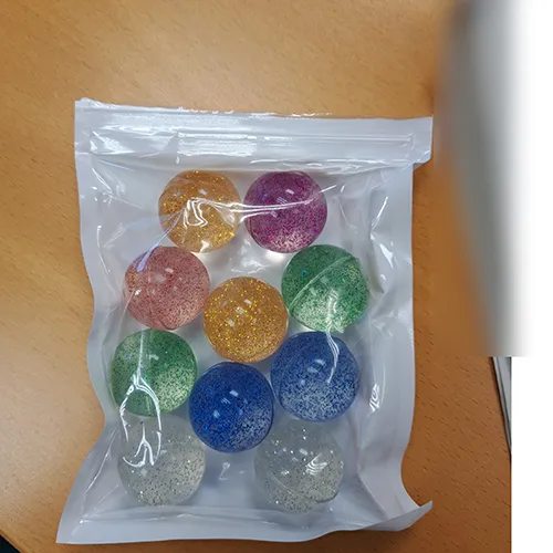 Set of 10 bouncy balls in various colours. Product sold online, in particular via Temu.