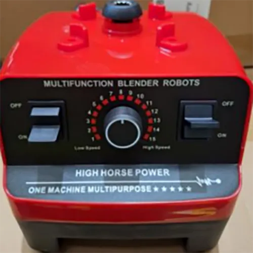An electronic red kitchen blender with detachable pouring cup.
