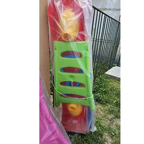 Freestanding plastic slide, 2 m high. The slide has steps leading to the seating area.