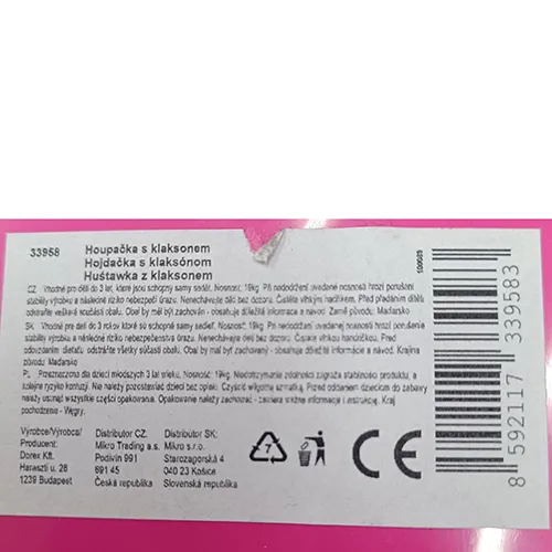Hanging plastic toy swing. The hanging system consists of a rope that is anchored in each corner of the swing and ends in two connectors with plastic ends. A plastic horn is located in the front center part.