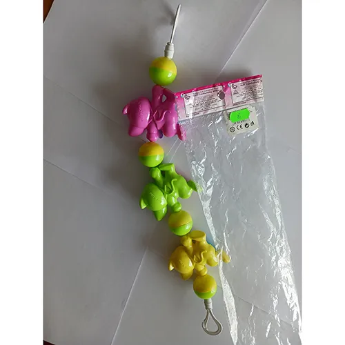 Colourful rattle toy with plastic cats and balls, strung on a rubber band, designed to be tied across a cradle, crib or stroller with hooks.