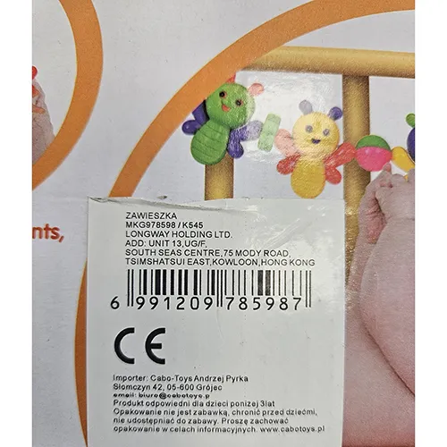 Toy rattle made of colourful frog-shaped figures strung on a string, with round balls in between.