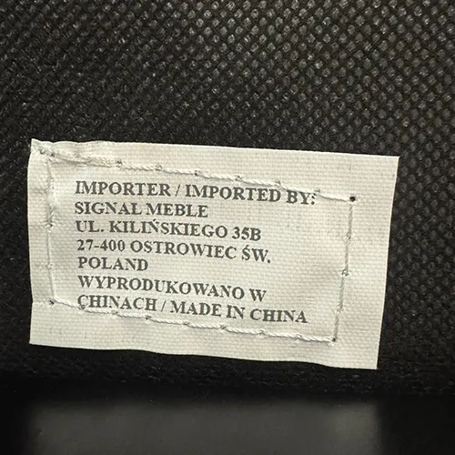 Household chair with padded seat and backrest.