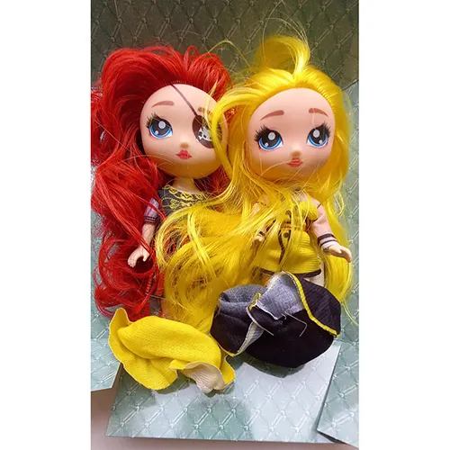 Plastic doll with painted eyes and red lips.