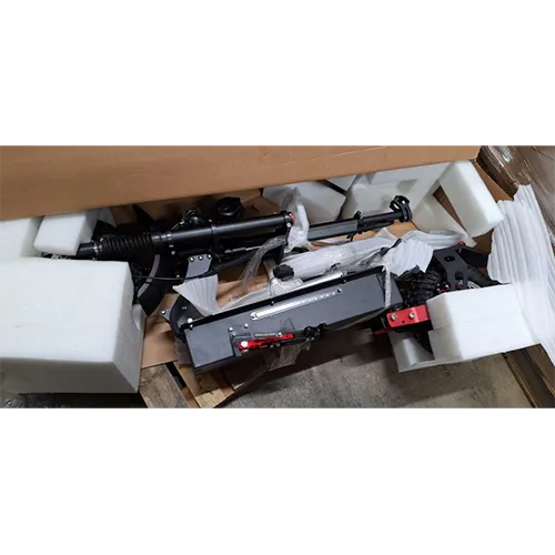 Electric scooter with charger and non-UK plug (2-pin). Other product identifiers “Racing Products” on red bracket