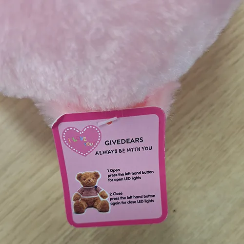 Plush toy in the shape of a teddy bear, containing a LED light with battery, 22 cm. Product sold online, in particular via AliExpress (unique identifier: 1005006298253975).