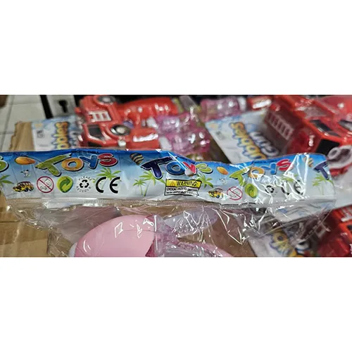 Pink plastic rabbit toy, with a switch. The toy moves forward, lights up and produces music when switched on.