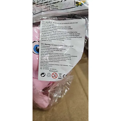 Pink plastic rabbit toy, with a switch. The toy moves forward, lights up and produces music when switched on.