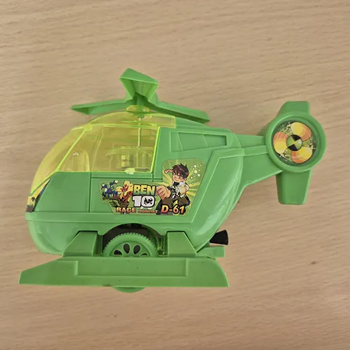 Green plastic animated helicopter toy with yellow plastic windows, two wheels and rotating wings. The toy has an inertial mechanism and colourful stickers are glued to the toy.