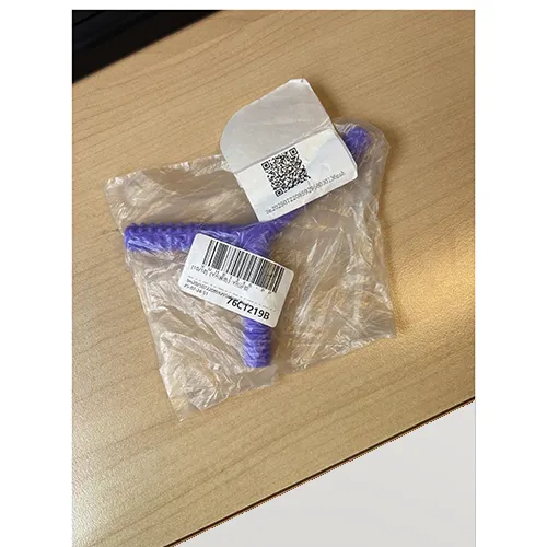 Teething toy of soft purple plastic in the shape of the letter Y, with various textures. Product sold online, in particular via eBay (unique identifier: 197497295169).