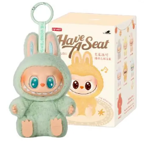 Soft toy in the shape of a Labubu-like monster with a metal ring. Part of the 