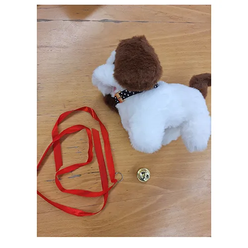 Electronic plush toy in the shape of a puppy with a red ribbon and collar with bell. Product sold online, in particular via Shein (unique identifier: sl2311262284392222).