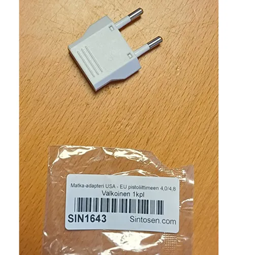 Travel adaptor in black or white with class II EURO plug and socket outlet for US class II Type A and schuko plug.