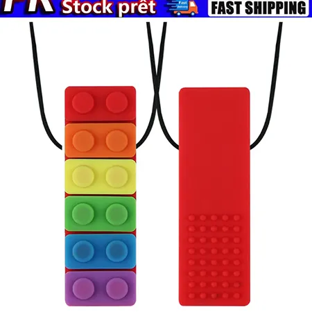 Teether in the shape of a toy construction brick with a cord and detachable parts. Product sold online, in particular via eBay (unique identifer: 167636875338).