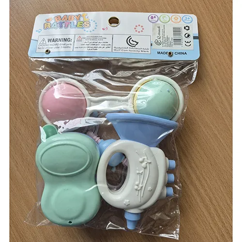 Set of four colourful rigid plastic rattles filled in several shapes, with rattling balls.