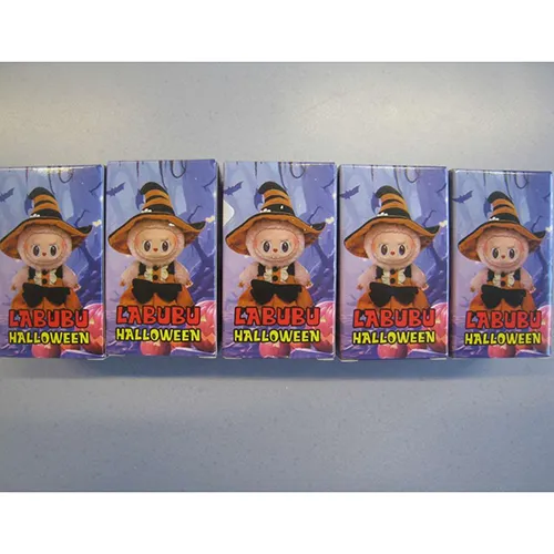 Soft toy, made of plastic and felt, in the shape of a Labubu-like doll. The toy includes a strap. Production date: June 2025.