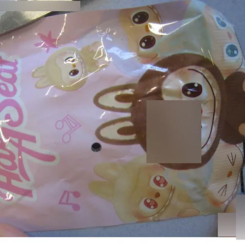 Soft toy, made of plastic and felt, in the shape of a Labubu-like doll. The toy includes a strap. Production date: June 2025.