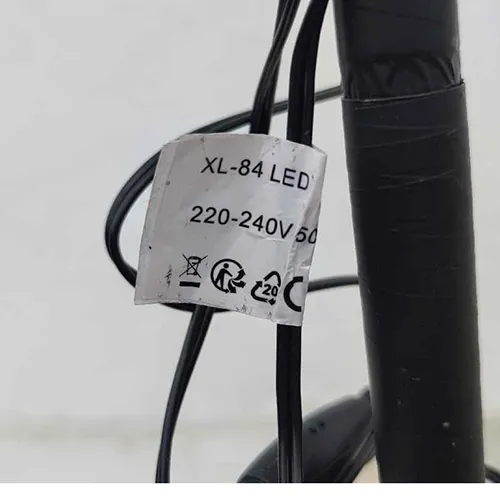 Yellow lighting chain with LED lights in the shape of a tree.