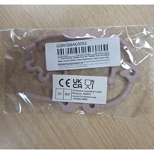 Pink soother holder, made from silicone. Product sold online, in particular via AliExpress (unique identifier: 1005006996585071).