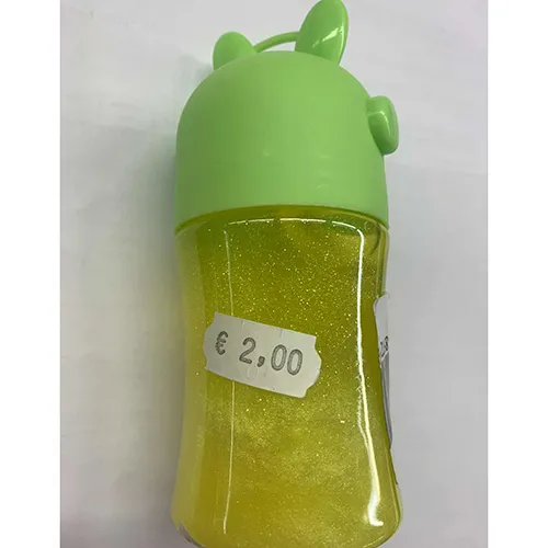 Yellow toy slime packaged in a plastic container with a green lid decorated with ears and star patterns.