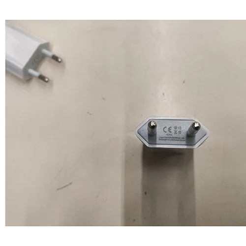 White USB charger with an input of 100-240V, 50/60 Hz, 0.15A, and an output of 5V, 2.4A.