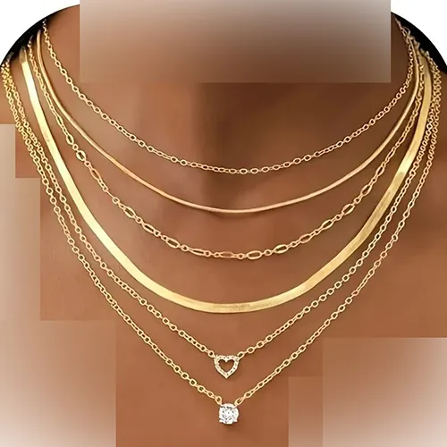 Set of six necklaces. One copper-coloured metal necklace with an imitation gemstone charm. One golden metal necklace with an imitation gemstone charm. One golden, simple metal chain. One golden flat link chain. One golden metal necklace with a heart charm. Product sold online, in particular via Temu.