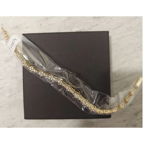 Golden metal bracelet with rhinestones. Product sold online, in particular via AliExpress (unique identifier: 1005007161804011).