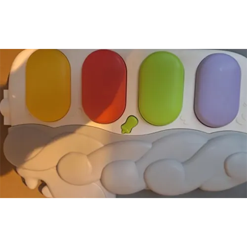 Children’s playmat containing multiple buttons and other stimulation accessories.