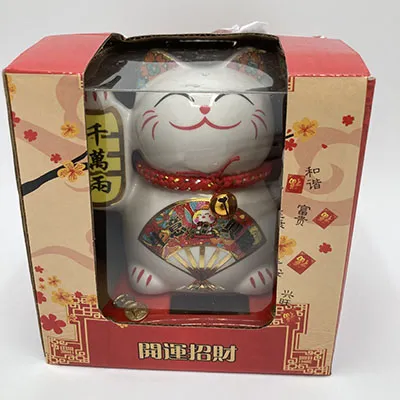 Decoration cat with waving function, powered by solar cell.