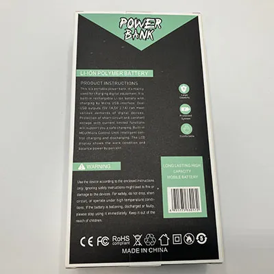 Black powerbank, approximately 25 cm in length, with a solar panel, LCD display and four built-in charger cables and dual USB outputs. Product sold online, in particular via ovbutiken.se.