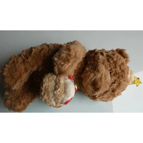 Soft toy, in the shape of a brown teddy bear with a birthday hat holding a cake in its hands. Product sold online, in particular via Shein.