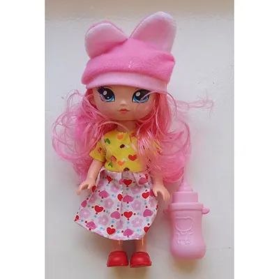 Plastic doll with painted eyes and red lips, wearing a dress.