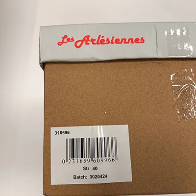 Tan sandals in PVC. The sandal has two straps with buckles.