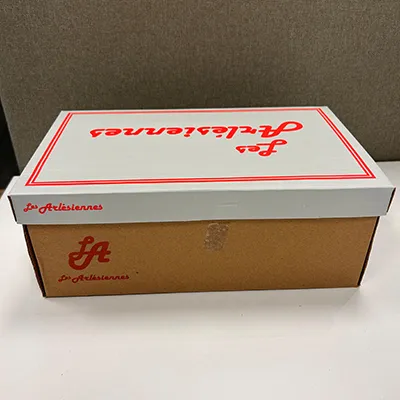 Tan sandals in PVC. The sandal has two straps with buckles.