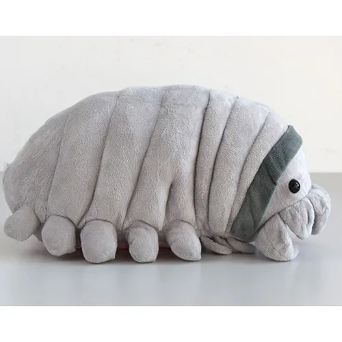 Grey plush figure in the shape of an animal with pink plush covering on the belly.