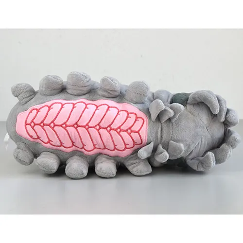 Grey plush figure in the shape of an animal with pink plush covering on the belly.