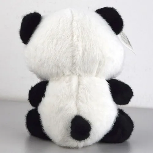 Black and white plush panda toy with a pink ribbon around its neck.