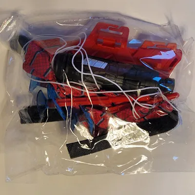 Glove with a trigger mechanism and suction cup darts. Product sold online, in particular via Shein (unique identifier: sl25060350202153043).