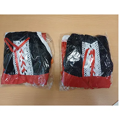 Little Red Riding Hood fancy-dress costume consisting of a red headband, a pumpkin-shaped bag, a white apron, a white, black and red dress and a red hooded cape. Product sold online, in particular via TikTok.