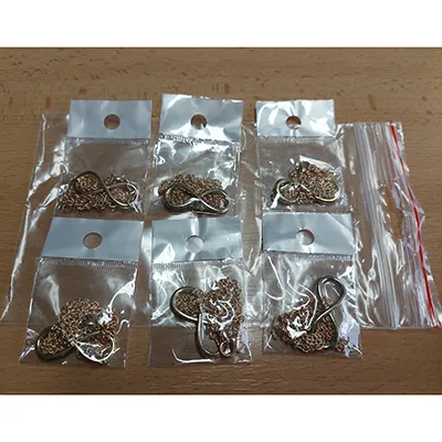 Gold-coloured necklace, 490 mm long with a gold-coloured infinity pendant that measures 31x13 mm. Product sold online, in particular via eshop.drevotok.sk.