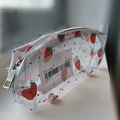 Transparent PVC pencil case with strawberry prints. Product sold online, in particular via Temu.