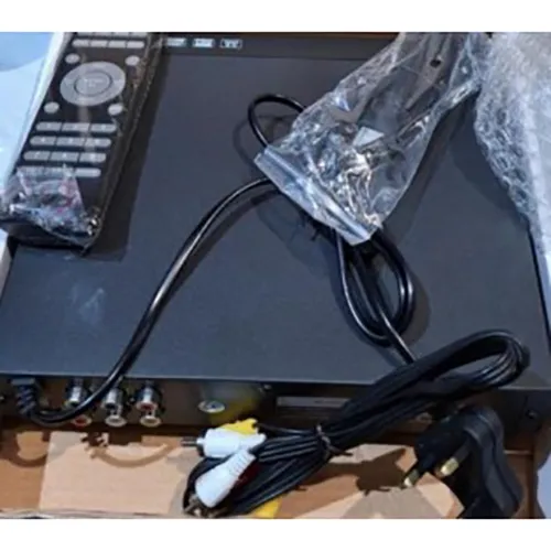 DVD player with remote control and wall plug.