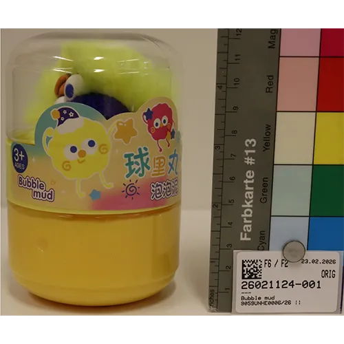 A set consisting of yellow slime and a soft toy with a key ring.
