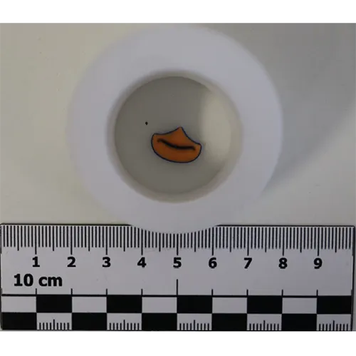 A set consisting of yellow slime and a soft toy with a key ring.