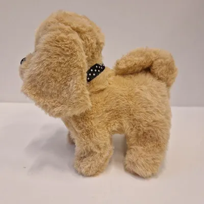 Soft toy in the shape of a dog with a batteries compartment.