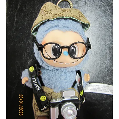 Soft toy with a key ring in the shape of a Labubu-like monster.