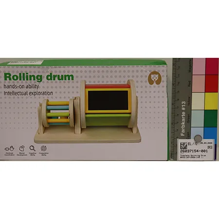 Wooden toy set consisting of one cylinder with its sides made of bars, containing balls; one wooden section with a support for the cylinder on one side and a rotating cylinder with a mirror on the other side Product sold online in particular via montessoritoddlers.com.