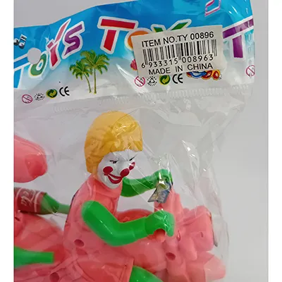 Colourful plastic toy motorcycle with a clown face on the driver spot and an inertial mechanism, pulled by a string.